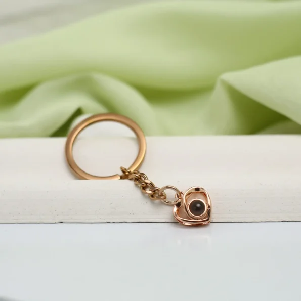 Personalized crossed heart keychain with hidden image, a touching gift for love and memories.