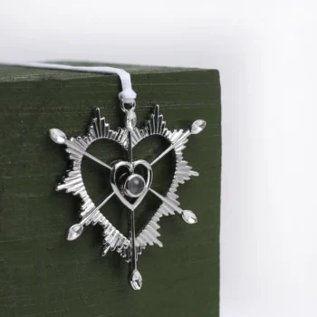 Elegant Sacred Heart ornament with hidden photo projection, perfect for faith-filled remembrance and gifting.