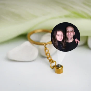 Personalized circle keychain with photo projection, a festive Christmas gift and decoration idea.