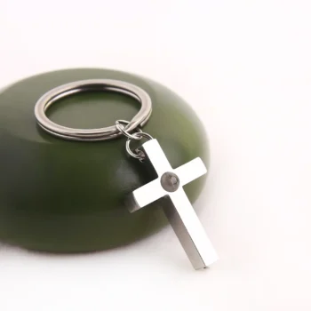 Cross bar keychain with hidden projection photo inside, a spiritual keepsake for Christian faith and love.