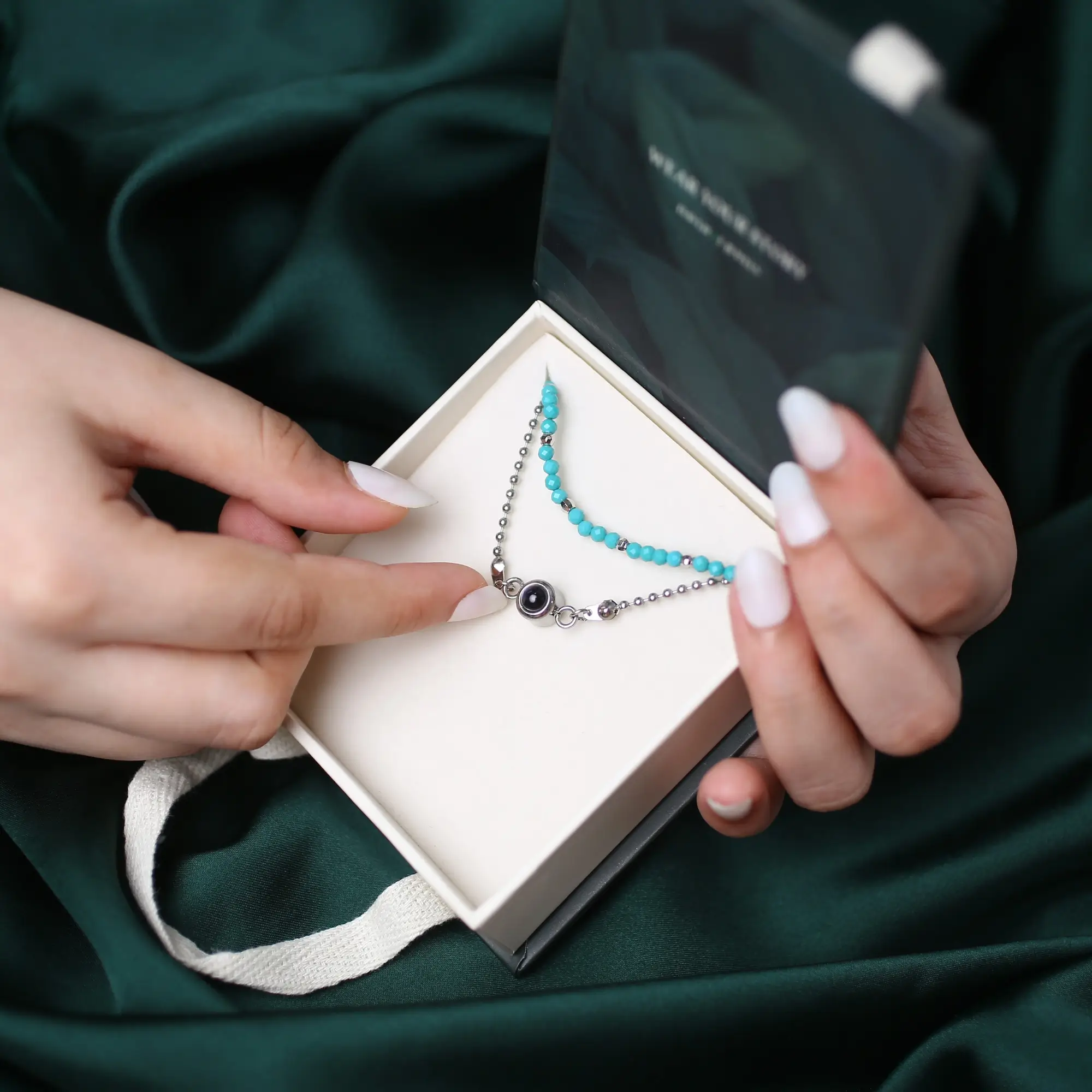 crystal bead memory keepsake bracelet Crystal bead bracelet with secret photo inside, a stylish and meaningful jewelry piece.