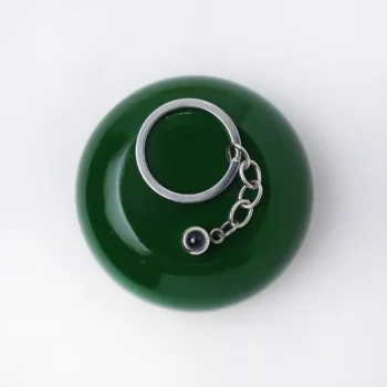 Elegant circle projection keychain with hidden photo inside, a special keepsake for family.