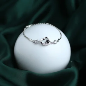 Eternal heart bracelet with CZ stone and hidden photo inside, a meaningful keepsake for loved ones.