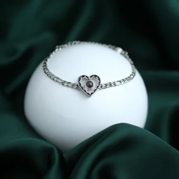 Hollow heart projection bracelet with hidden image inside, a sentimental jewelry piece for men or fathers.