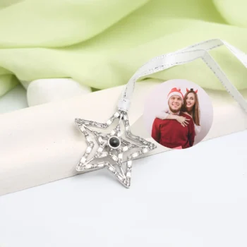 Custom silver star ornament with hidden photo inside, a heartfelt Christmas tree decoration.
