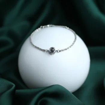 Thin chain eternal link bracelet with projection photo inside, a modern keepsake of memories.