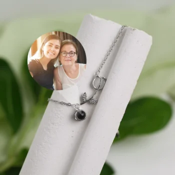 Elegant silver floral vine bracelet with hidden projection photo, a one-of-a-kind jewelry gift.