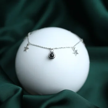 Silver star charm bracelet with secret picture inside, a heartfelt keepsake for her.