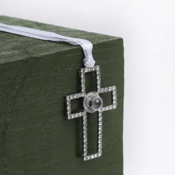 Personalized Christmas ornament in cross shape with hidden picture inside, ideal for gifting or honoring loved ones.