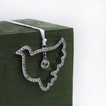 Custom dove ornament holding a hidden picture, symbolizing love, peace, and remembrance during Christmas.