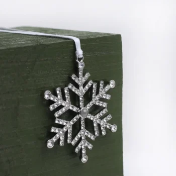 Personalized snowflake ornament with hidden photo, a meaningful gift and decoration for Christmas.