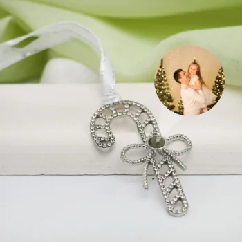 Personalized candy cane ornament with picture inside, ideal for tree décor and family keepsakes.