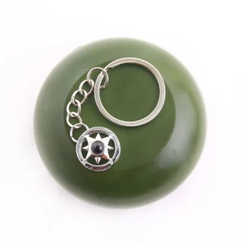 Compass keychain with hidden projection photo, a personalized keepsake for gifting and remembrance.