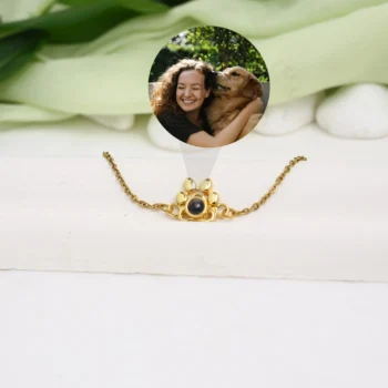 Personalized bracelet with paw print charm and hidden picture inside, a heartfelt pet lover gift.