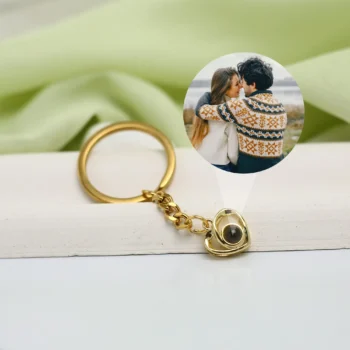 Custom crossed heart keychain featuring a secret projection picture, perfect for couples.