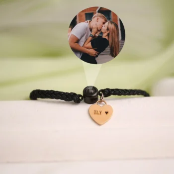 Circle rope bracelet with heart charm and secret projection photo inside.