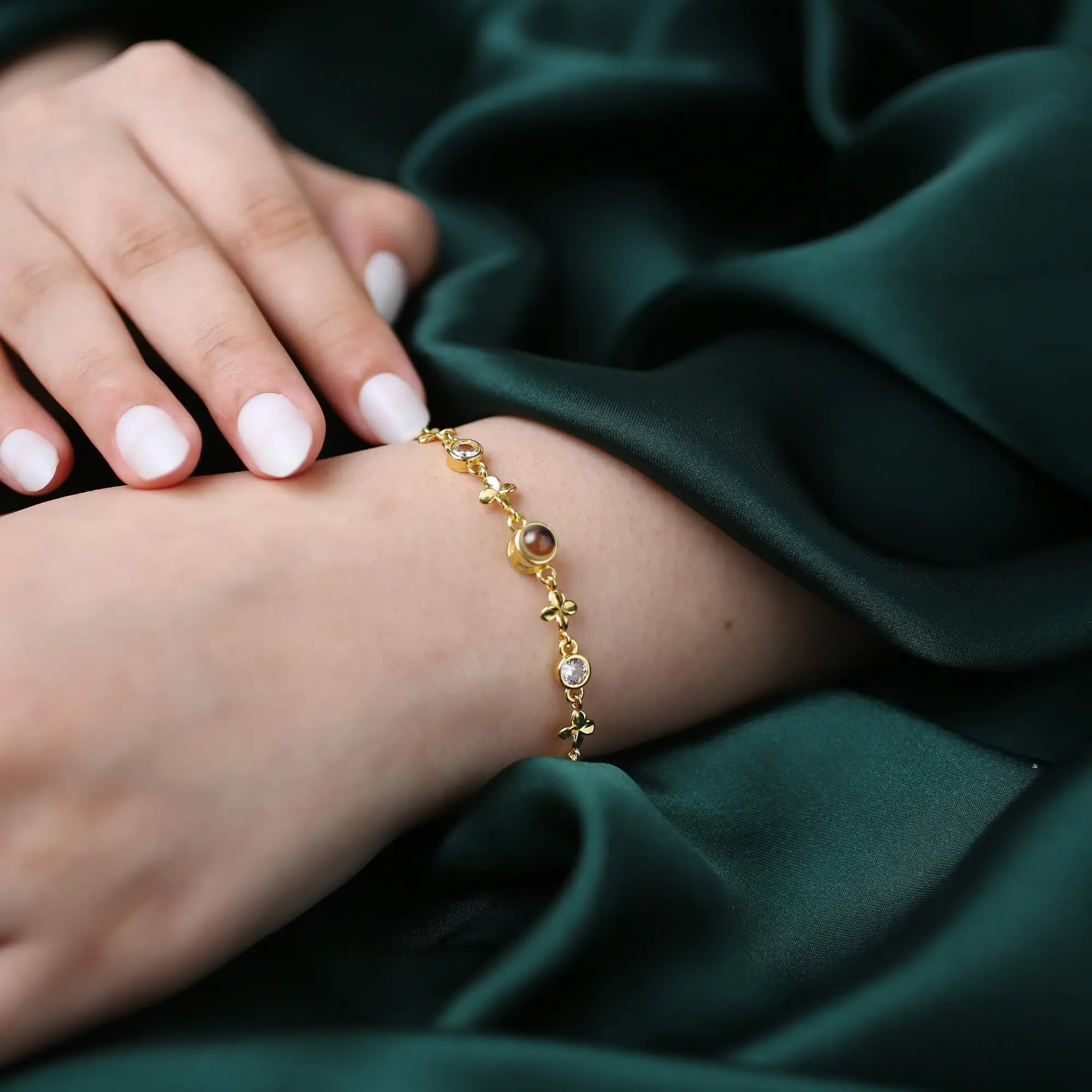 sentimental clover photo bracelet Clover bracelet with hidden photo inside, a meaningful keepsake for women.