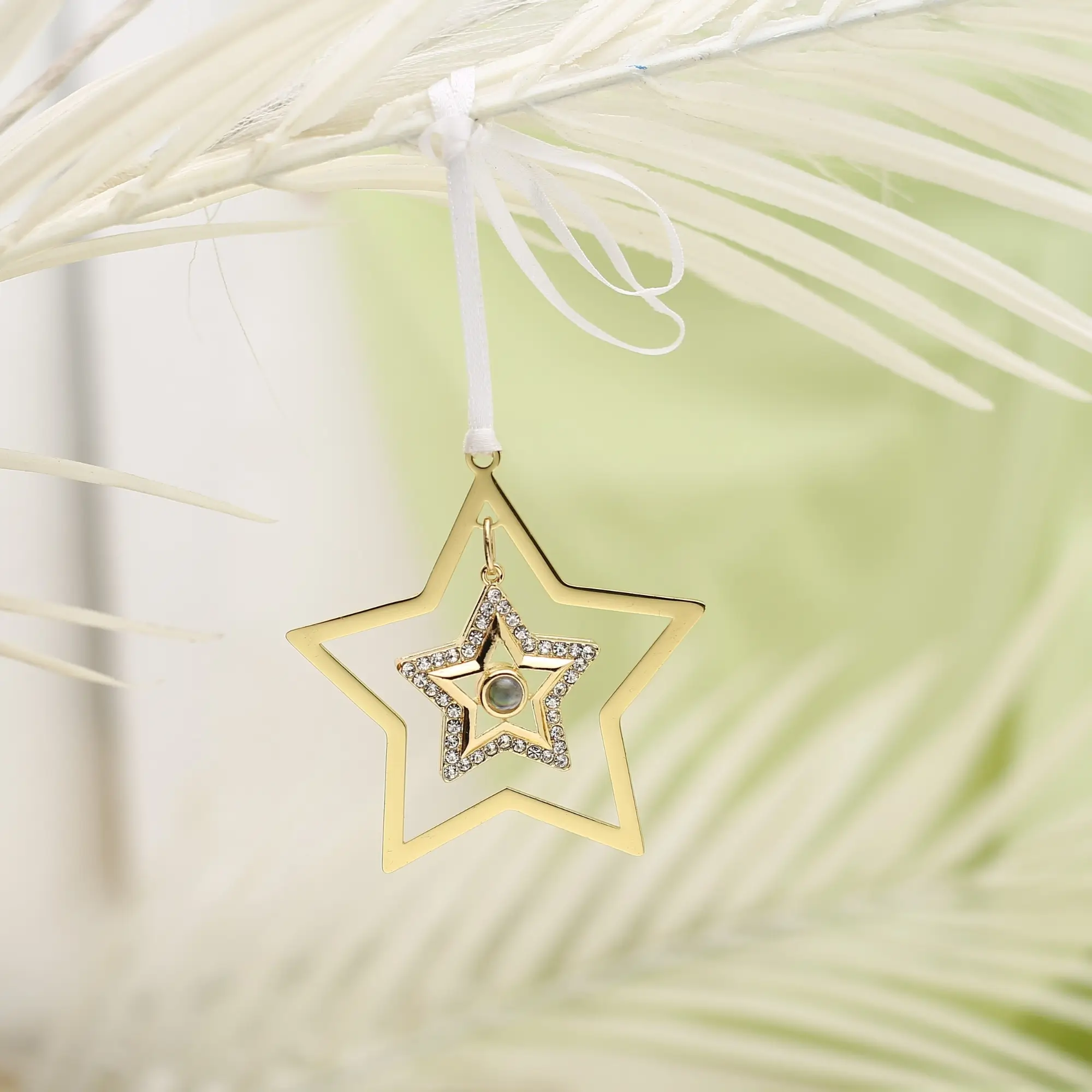 star ornament picture inside Star-shaped ornament with hidden image projection, perfect personalized Christmas keepsake.