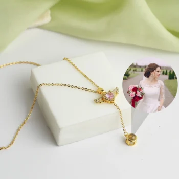 Angel wings necklace with secret photo projection inside, a meaningful jewelry piece full of comfort and care.