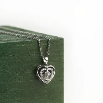 Elegant double heart pendant revealing a hidden picture inside, perfect for expressing love and devotion.