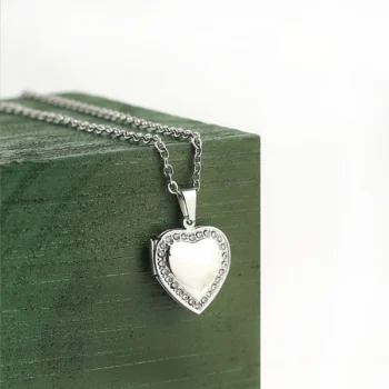 Double photo locket pendant with two engraved pictures inside, capturing love and connection in every detail.