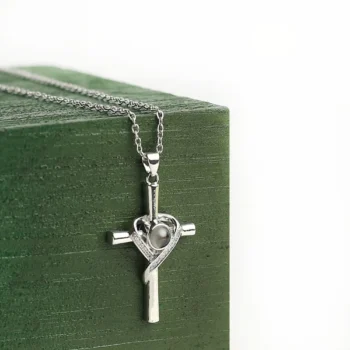 Faith-inspired cross pendant featuring a hidden projection photo, a timeless keepsake of love and divine guidance.