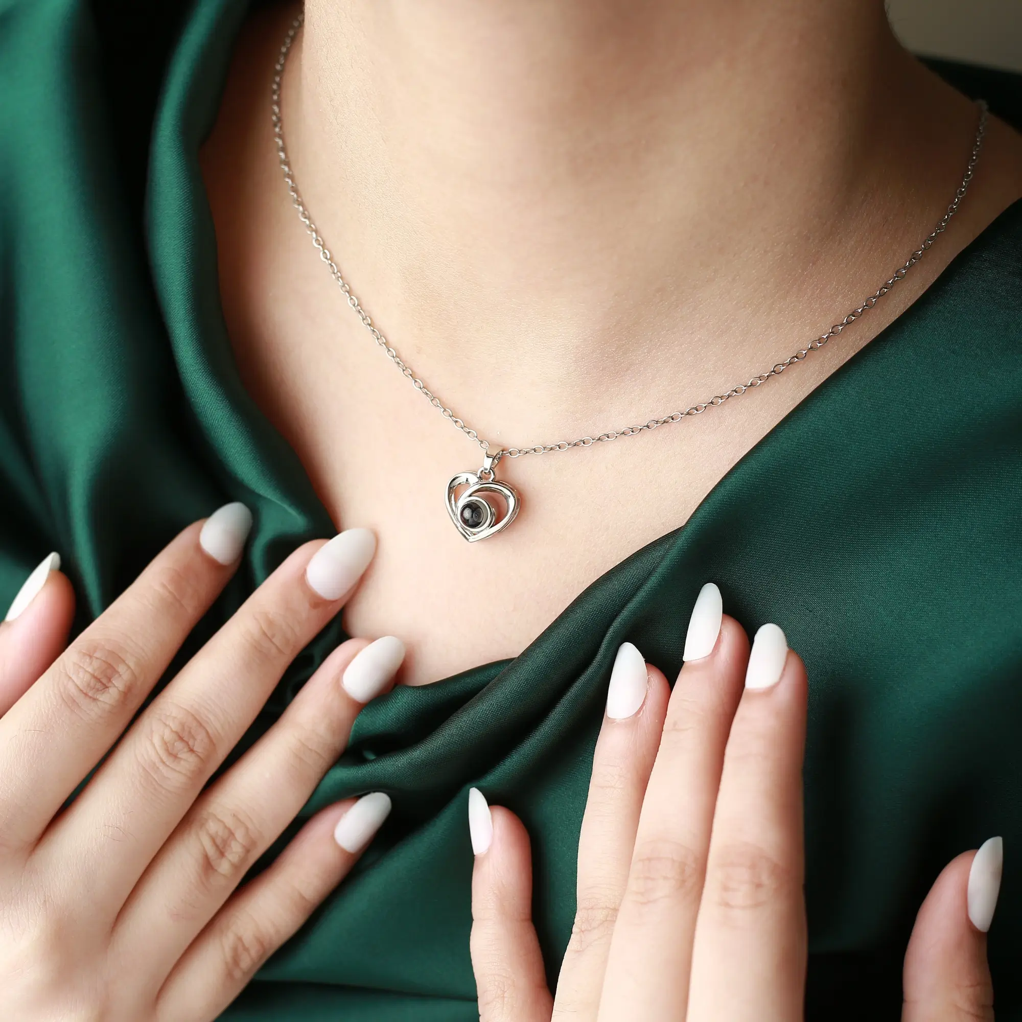 Modern crossed heart pendant for men with hidden photo, a meaningful symbol of love and devotion.