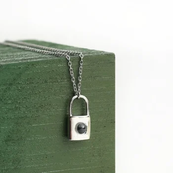 Love lock pendant with secret photo projection inside, a romantic keepsake for birthdays, anniversaries, or special occasions.