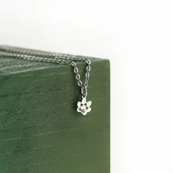 Custom paw print pendant engraved with name or text, a beautiful pet lover gift.