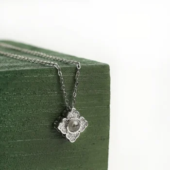 Custom four-leaf clover necklace with secret picture projection, representing hope, faith, and love.