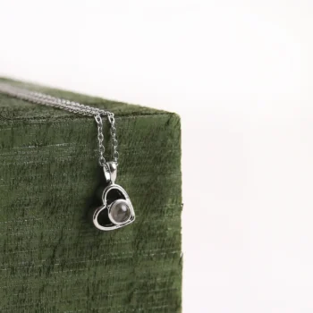 Photo projection heart necklace that holds a hidden picture inside, meaningful romantic jewelry for women.