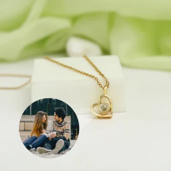 Hidden picture heart pendant necklace with personalized projection stone and delicate chain.