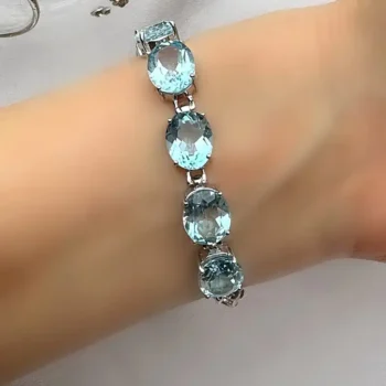Genuine Sky Blue Topaz & White Topaz Silver Transverse Oval Halo Bracelet