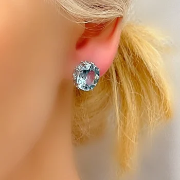Genuine Sky Blue Topaz Oval Halo 3D Silver Stud Earrings